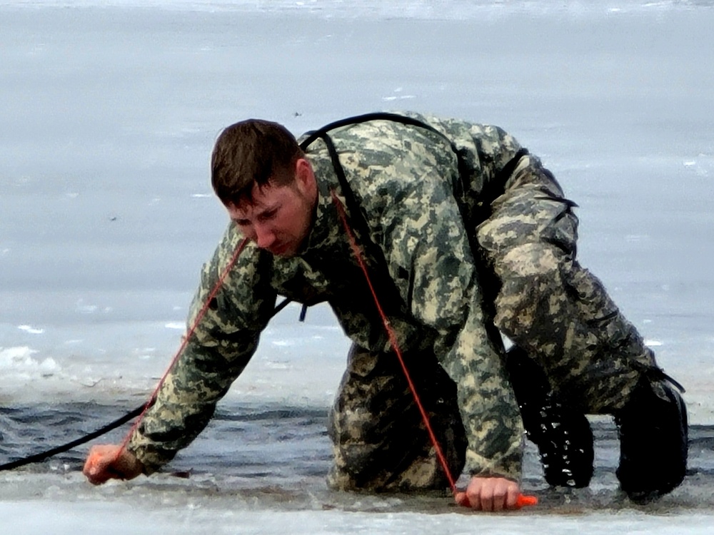 Cold-Weather Operations Course students jump in for cold-water immersion training at Fort McCoy