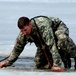 Cold-Weather Operations Course students jump in for cold-water immersion training at Fort McCoy