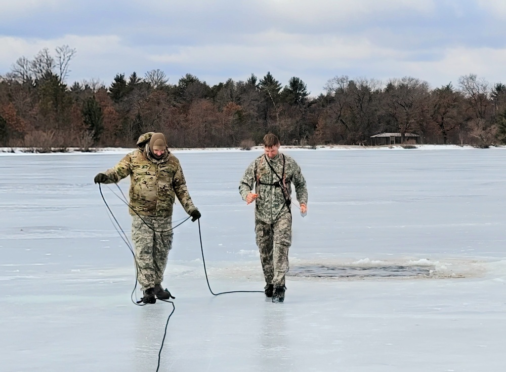 Cold-Weather Operations Course students jump in for cold-water immersion training at Fort McCoy