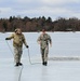 Cold-Weather Operations Course students jump in for cold-water immersion training at Fort McCoy