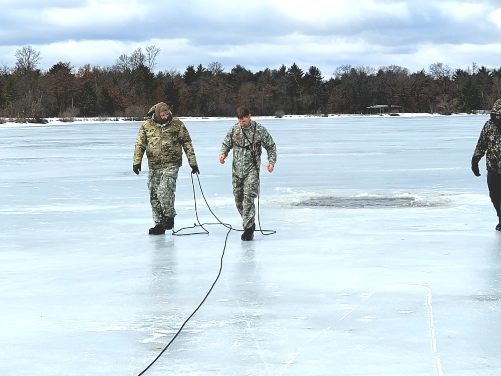 Cold-Weather Operations Course students jump in for cold-water immersion training at Fort McCoy