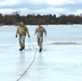 Cold-Weather Operations Course students jump in for cold-water immersion training at Fort McCoy