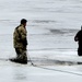 Cold-Weather Operations Course students jump in for cold-water immersion training at Fort McCoy