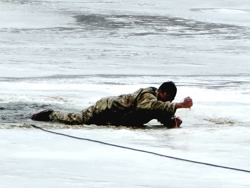 Cold-Weather Operations Course students jump in for cold-water immersion training at Fort McCoy