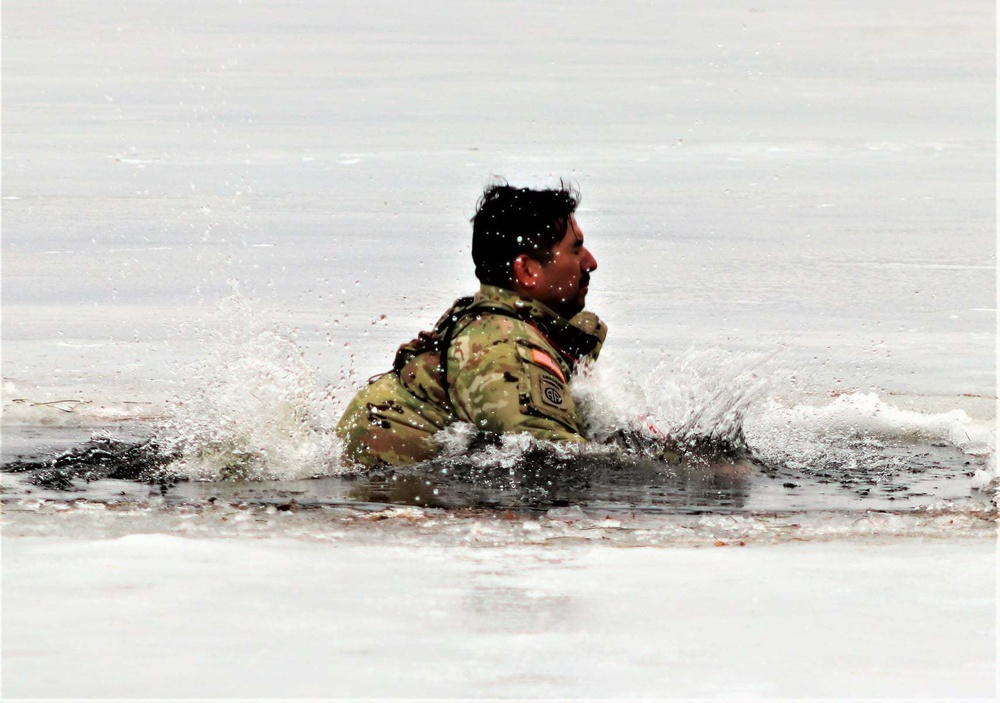 Cold-Weather Operations Course students jump in for cold-water immersion training at Fort McCoy