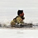 Cold-Weather Operations Course students jump in for cold-water immersion training at Fort McCoy