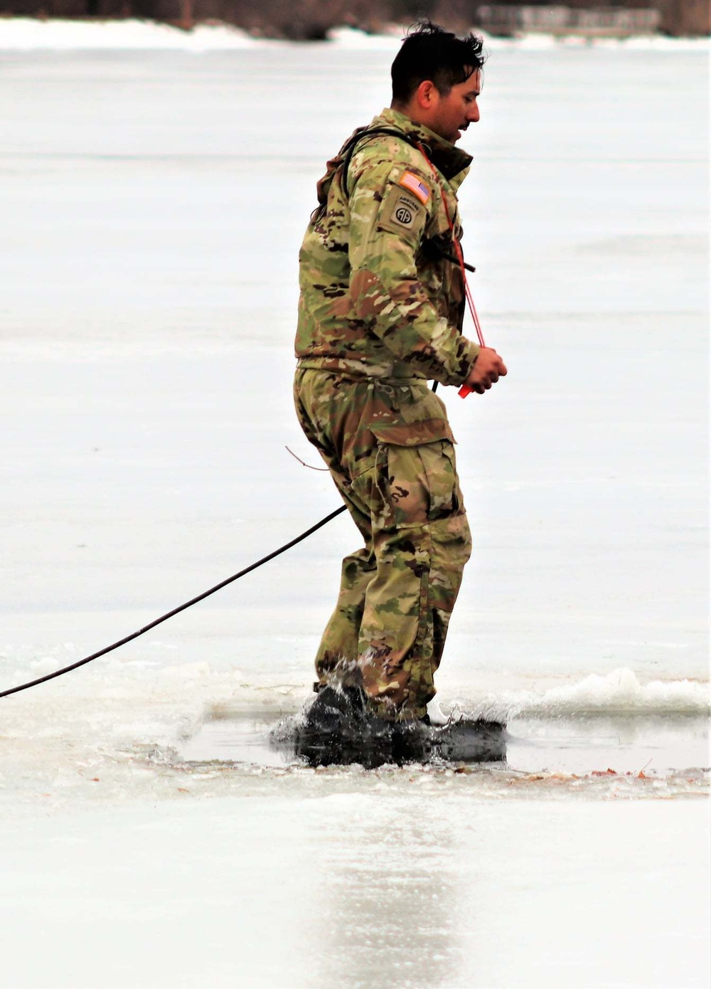 Cold-Weather Operations Course students jump in for cold-water immersion training at Fort McCoy