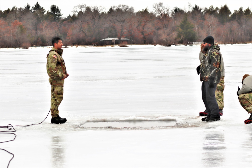 Cold-Weather Operations Course students jump in for cold-water immersion training at Fort McCoy