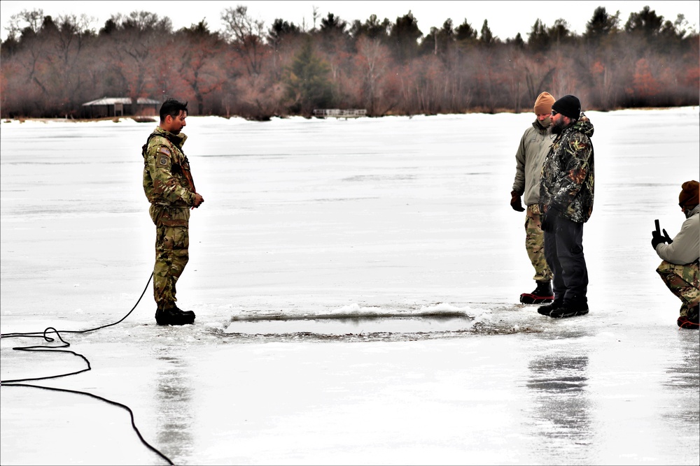 Cold-Weather Operations Course students jump in for cold-water immersion training at Fort McCoy