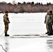 Cold-Weather Operations Course students jump in for cold-water immersion training at Fort McCoy