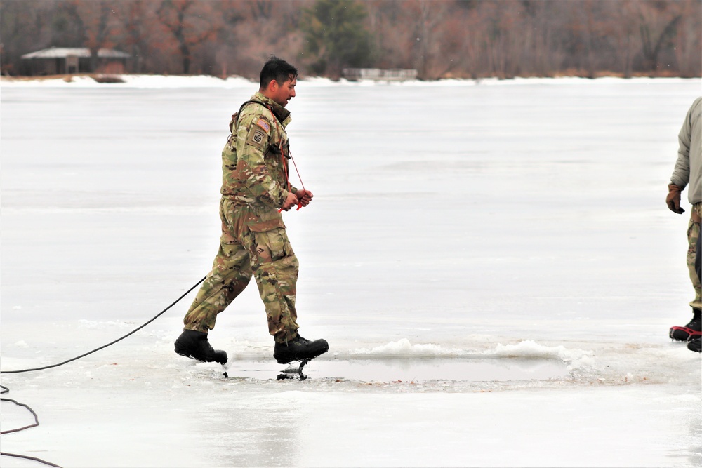 Cold-Weather Operations Course students jump in for cold-water immersion training at Fort McCoy