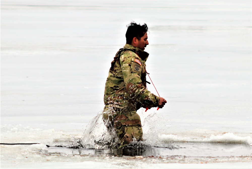 Cold-Weather Operations Course students jump in for cold-water immersion training at Fort McCoy