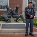 WWII hero in front of Clemson WWII monument