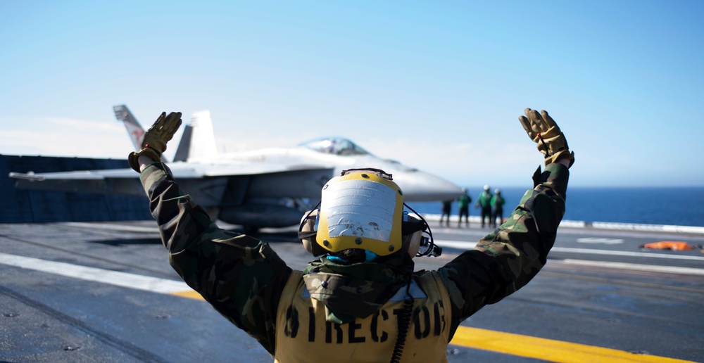 Sailor Directs An F/A-18E Super Hornet