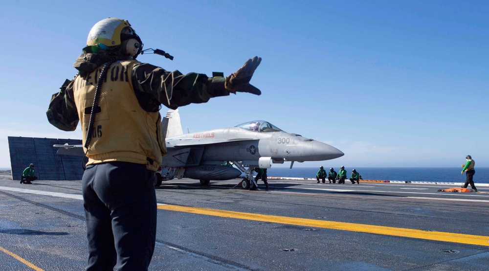 Sailor Directs An F/A-18E Super Hornet