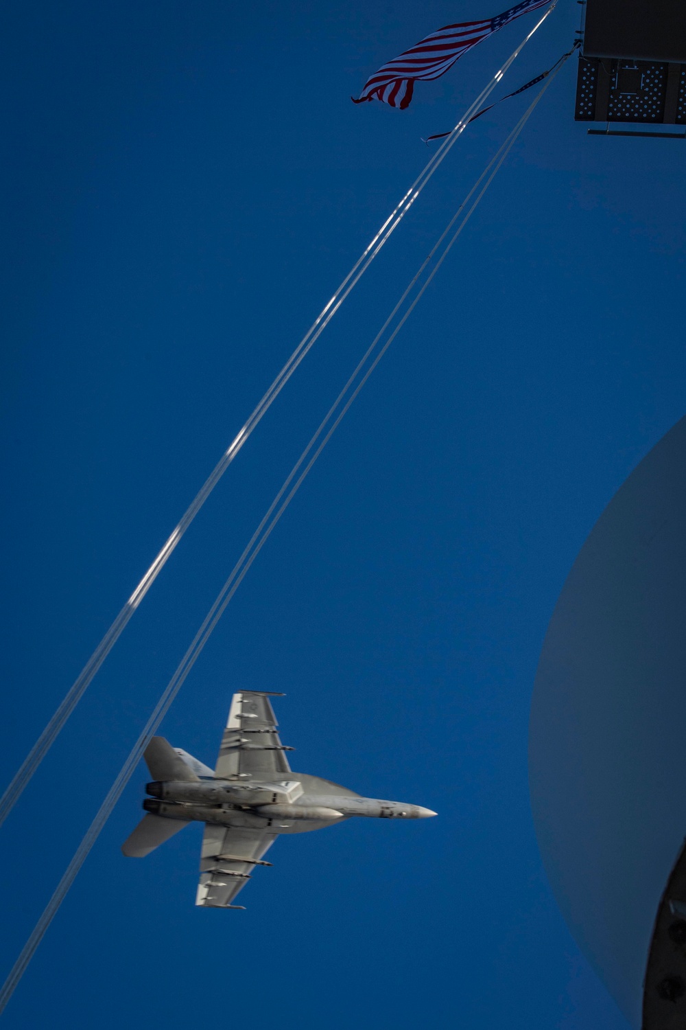 An F/A-18E Super Hornet Flies Over The USS Nimitz