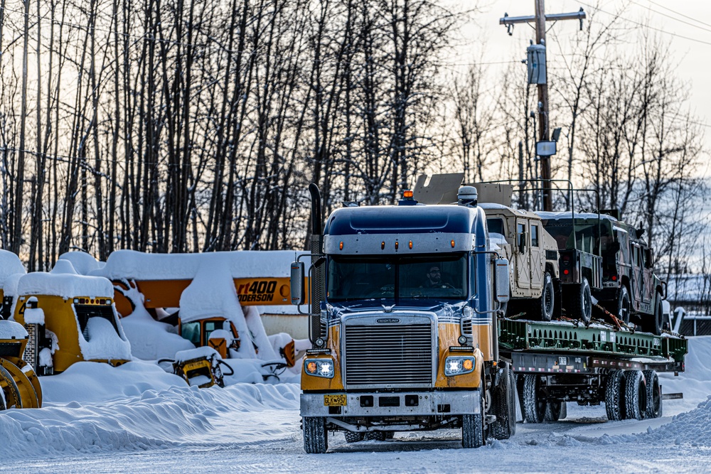 1-265th ADA unload Humvees for AE22