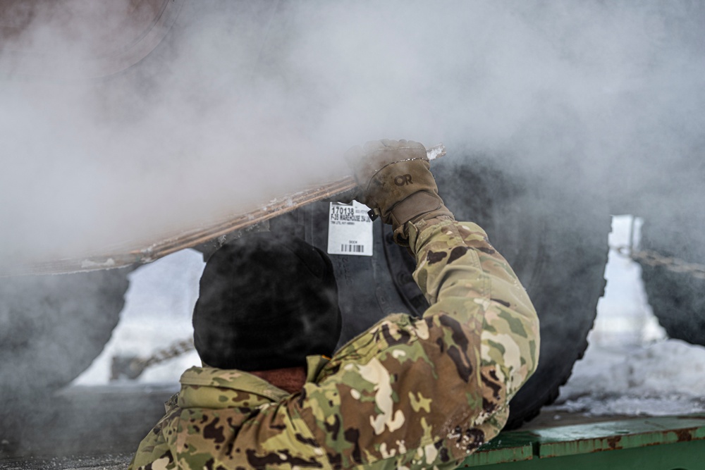 1-265th ADA unload Humvees for AE22