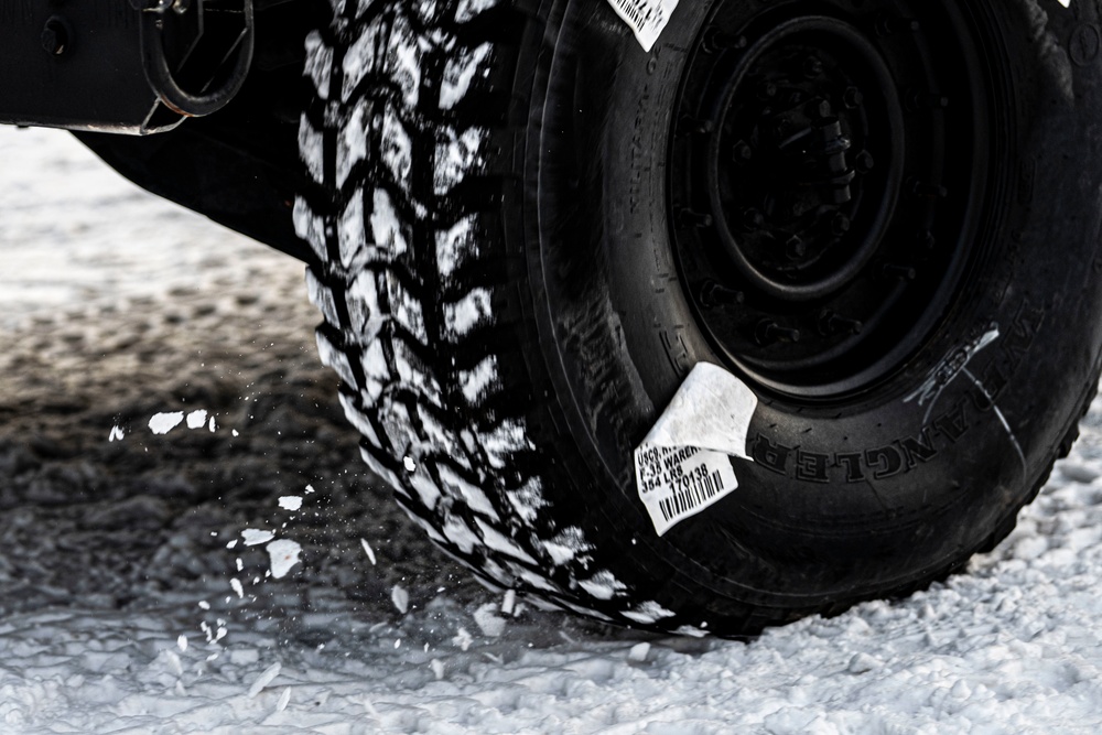 1-265th ADA unload Humvees for AE22