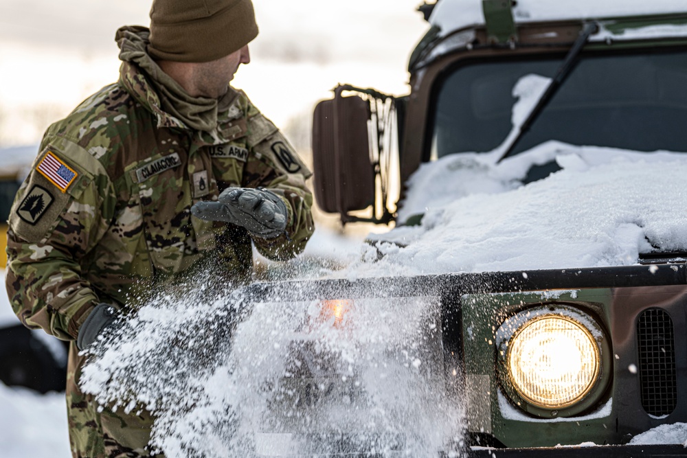 1-265th ADA unload Humvees for AE22