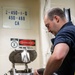 Sonar Technician (Surface) 1st Class Simon Lader (center), from Pensacola, Fla., launches the AN/SLQ-25 Nixie