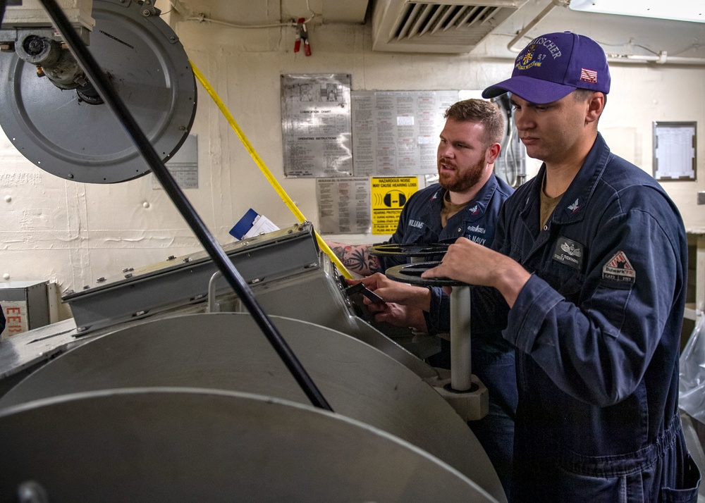 Sonar Technician (Surface) 2nd Class Jesse Elmore (left), from Austin, Texas, and Sonar Technician (Surface) 3rd Class Cody Dickmann (right), from San Diego, Calif., operate the AN/SLQ-25 Nixie winch