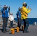 Sailors aboard Arleigh Burke-class guided-missile destroyer USS Mitscher (DDG 57) verify chocks and chains are removed from a MH-60R Sea Hawk helicopter