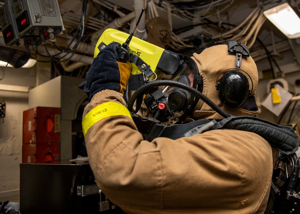 Damage Controlman Fireman Michael Resendiz, from Los Angeles, Calif., uses a Naval Firefighter Thermal Imager during a firefighting drill