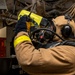 Damage Controlman Fireman Michael Resendiz, from Los Angeles, Calif., uses a Naval Firefighter Thermal Imager during a firefighting drill