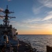 An F/A-18E Super Hornet assigned to the “Blue Blasters” Strike Fighter Squadron 34 conducts a flyby of Arleigh Burke-class guided-missile destroyer USS Mitscher (DDG 57)