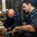 Gunner’s Mate 2nd Class Jay Davis (left), from Virginia Beach, Va., and Fire Controlman 2nd Class Ryan Kreiner (right), from Temecula, Calif., conduct maintenance on a magazine sprinkler system