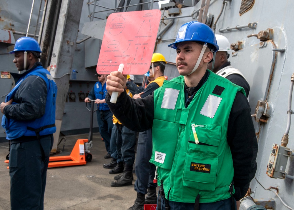 Professional Apprenticeship Career Tract (PACT) Seaman Justin Estupinan, from Pompano Beach, Fla., serves as a signalman