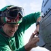 Sailor Conducts Maintenance On An MH-60S Sea Hawk Helicopter