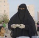 Noor Ahmad Al Baiti serves customers delicacies from her home-based cooking and baking business, Queen Cake, in Mukalla, Yemen on February 22, 2022.