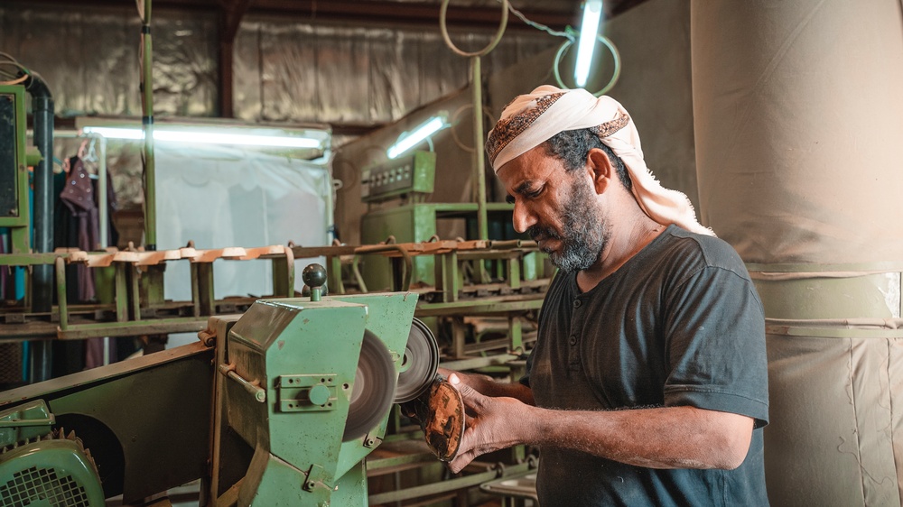 An employee works at the National Company for Leather Industries in Aden, Yemen on February 22, 2022.