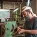 An employee works at the National Company for Leather Industries in Aden, Yemen on February 22, 2022.