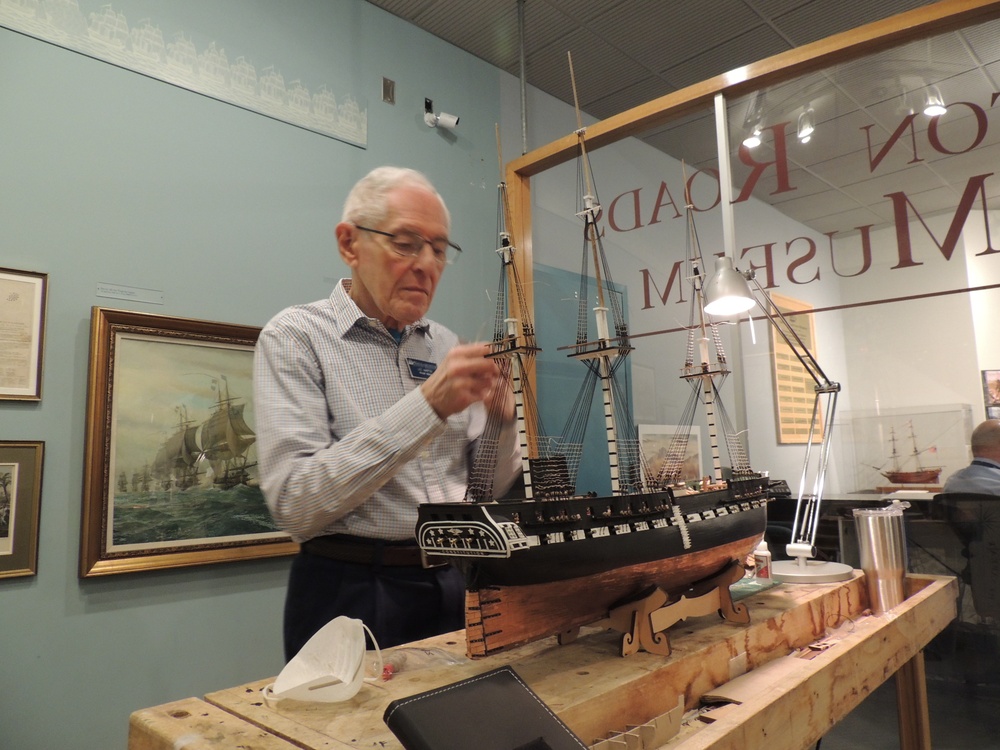 Volunteer model ship builder at Naval Museum