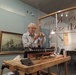 Volunteer model ship builder at Naval Museum