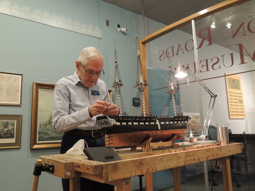 Volunteer model ship builder at Naval Museum