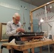 Volunteer model ship builder at Naval Museum