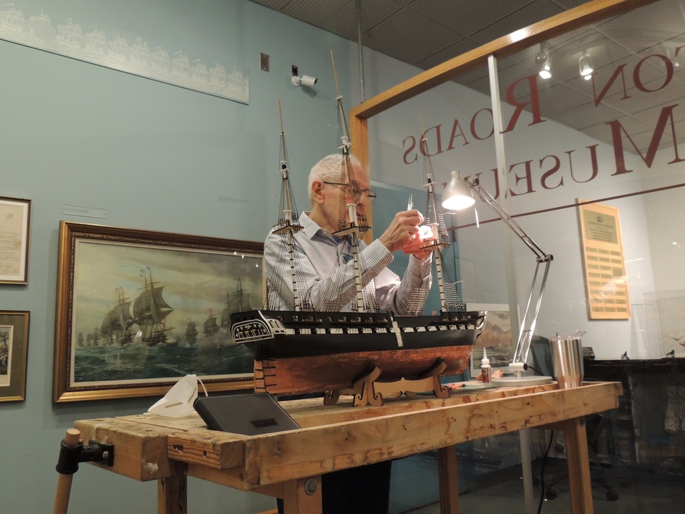 Volunteer model ship builder at Naval Museum