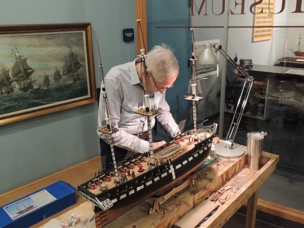 Volunteer model ship builder at Naval Museum