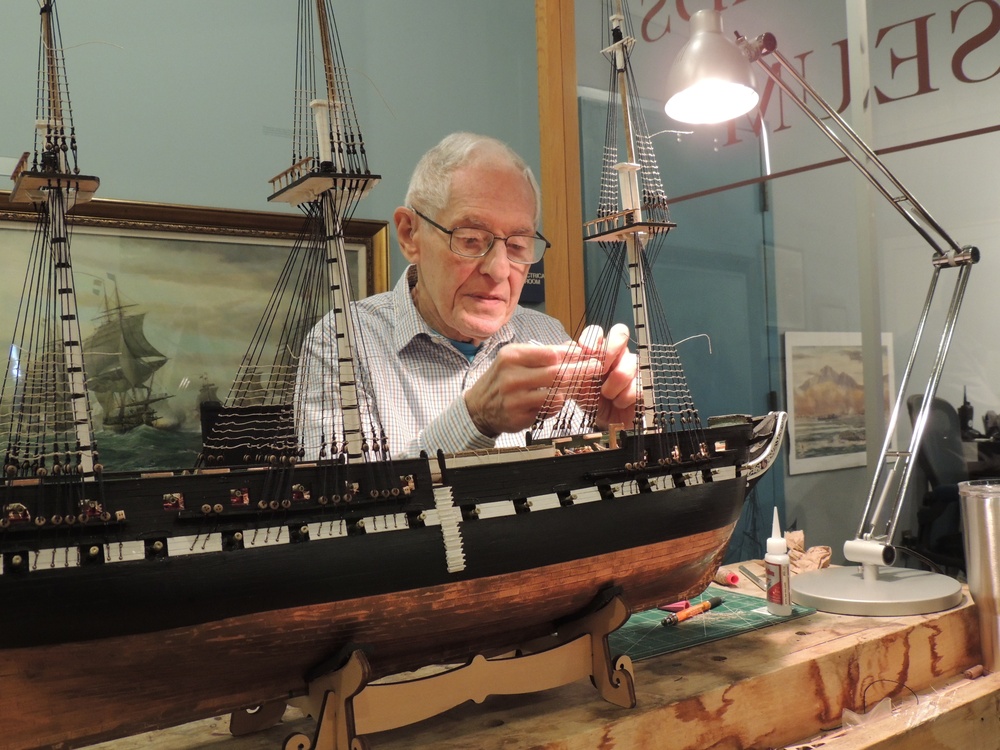 Volunteer model ship builder at Naval Museum