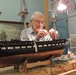 Volunteer model ship builder at Naval Museum