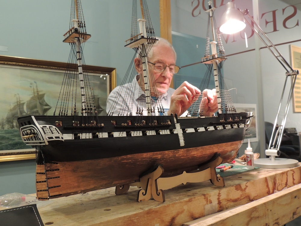 Volunteer model ship builder at the Hampton Roads Naval Museum