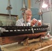 Volunteer model ship builder at the Hampton Roads Naval Museum