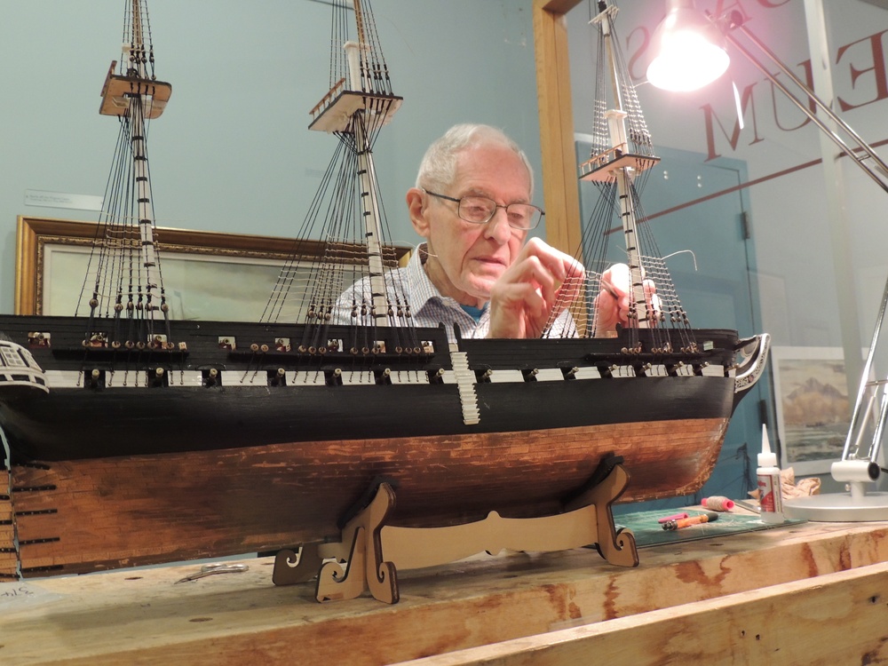 Volunteer model ship builder at Naval Museum