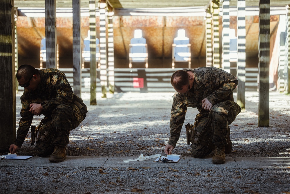 U.S. Marines with the 26th MEU participate in a Pistol Qualification Course
