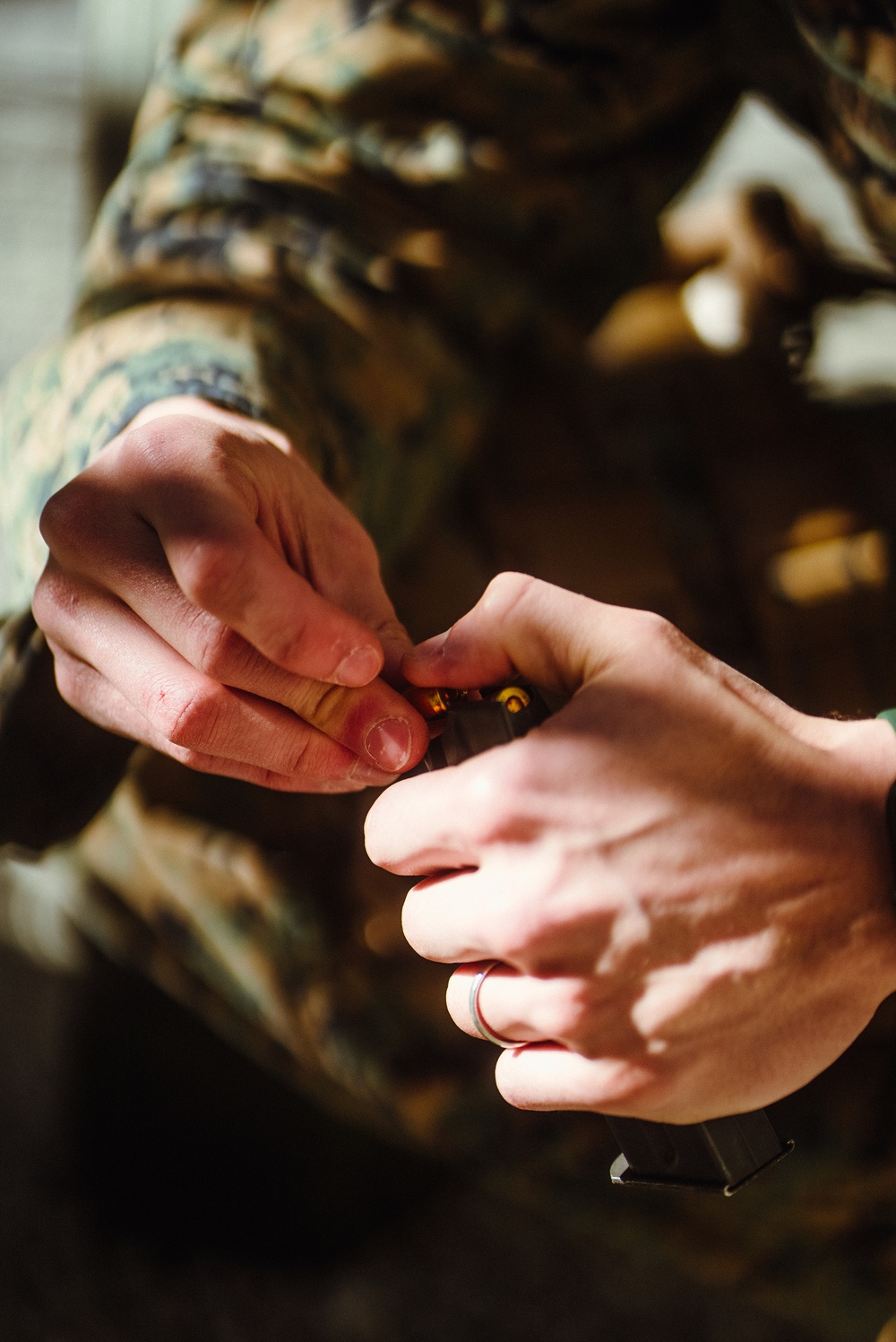 U.S. Marines with the 26th MEU participate in a Pistol Qualification Course