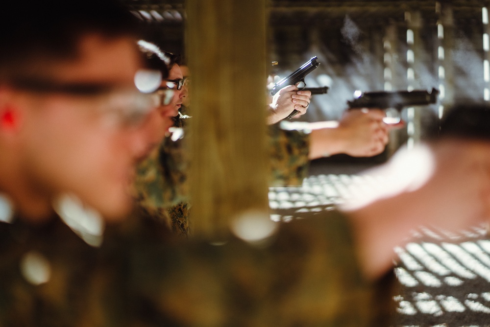 U.S. Marines with the 26th MEU participate in a Pistol Qualification Course